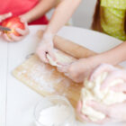 Corso di Pasticceria per Bambini 5-10 Anni a Bienate di Magnago – Dolce di Pasqua 28 Marzo 2 Corso di Pasticceria per Bambini 5-10 Anni a Bienate di Magnago – Dolce di Pasqua 28 Marzo close up hands preparing dough basis pizzas
